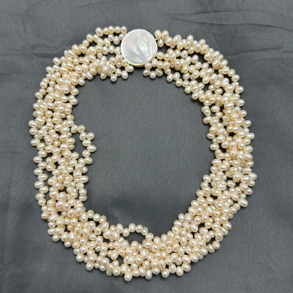 Salt Water Pearl Necklace
6 strand / 18 inches 
Magnetic mother of pearl clasp - Picture 1 of 7